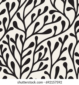 Vector seamless pattern. Floral stylish background. Bold silhouette of branches.