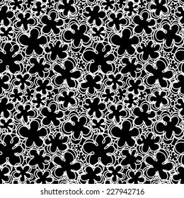 Vector seamless pattern with flowers of doodles. Floral background in hand drawn childish style. Ornamental decorative illustration for print, web