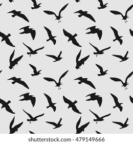 Vector seamless pattern with flying birds. Black raven silhouette illustration