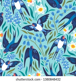 Vector seamless pattern with flying swallows and spring flowers: narcissuses, hyacinths and muscari