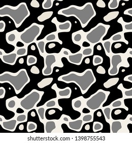 Vector seamless pattern. Free form organic shapes. Stylish structure of natural spots. Hand drawn abstract background. Can be used as swatch in Illustrator. Camouflage spotty print. Shades of grey.