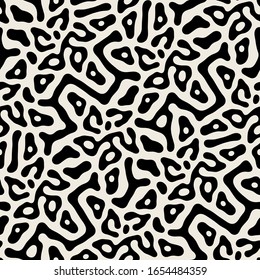 Vector seamless pattern. Free form organic shapes. Stylish structure of natural spots. Hand drawn abstract background. Can be used as swatch in Illustrator. Monochrome spotty print.