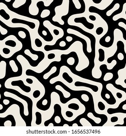 Vector seamless pattern. Free form organic shapes. Stylish structure of natural spots. Hand drawn abstract background. Can be used as swatch in Illustrator. Monochrome spotty print.