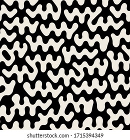 Vector seamless pattern. Free form organic shapes. Stylish structure of natural spots. Hand drawn abstract background. Can be used as swatch in Illustrator. Monochrome spotty print.