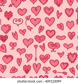 Vector seamless pattern with freehand drawn cartoon hearts on pink background
