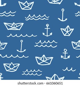Vector seamless pattern with freehand drawn cartoon paper ships anchors and waves on blue background