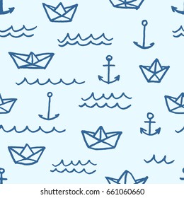 Vector seamless pattern with freehand drawn cartoon paper ships anchors and waves on blue background