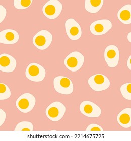Vector seamless pattern with fried eggs with trendy style. Suitable for textiles.
