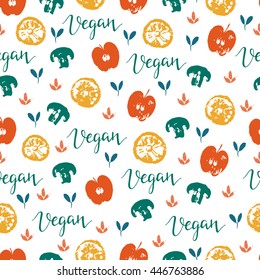 Vector seamless pattern with fruit and vegetables. Apples, lemon, mushrooms and word vegan.  Hand drawn background. Perfect for vegan food menu or surface pattern design.