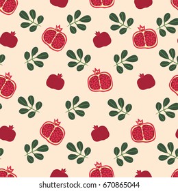 Vector seamless pattern with fruits and leaves of a red pomegranate.
