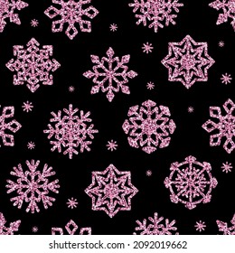 Vector seamless pattern glitter pink snowflakes isolated on black background.
