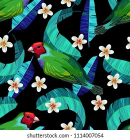 Vector seamless pattern with gouldian finch, flowers and palm leaves on black background. Realistic birds and plants. Colorful summer illustration.
