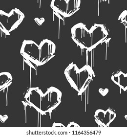 Vector seamless pattern with graffiti white hearts tags in grunge style on black background. Hand drawn hearts endless bafground