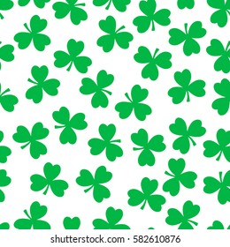 Vector seamless pattern. Green clover isolated on a white background. National holiday St.Patrick 's Day.