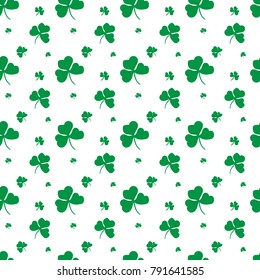 Vector seamless pattern with green clover leafs on white background for gift cards, invitation, textile, wrapping paper design.