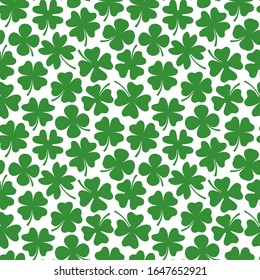 Vector seamless pattern with green four leaf cloversfor Saint Patrick's Day designs and backgrounds