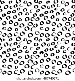 Vector seamless pattern of grunge spots and circles.