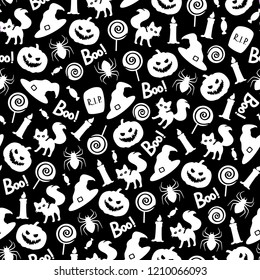 Vector seamless pattern with Halloween elements on black background. Perfect for wrapping paper or fabric. 