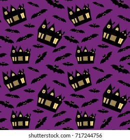 Vector seamless pattern for Halloween with haunted houses and bats on purple background