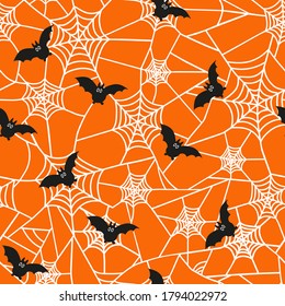 Vector seamless pattern for the Halloween holiday. Cobwebs and bats on an orange background. Horror texture  for party decor, wrapping paper, invitations.