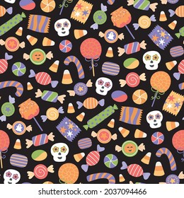 Patrón vectorial sin fisuras para Halloween con dulces tradicionales, caramelos, lollipop decorado con elementos de halloween y adornos.