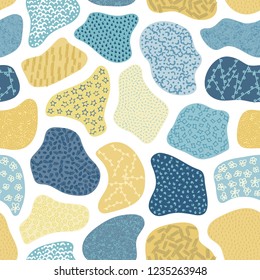 Vector seamless pattern with hand drawn abstract shapes. Textured figures. Unique design. Creative background. It looks like cloth scraps or pebbles. Wallpaper, textile, wrapping, print on clothes