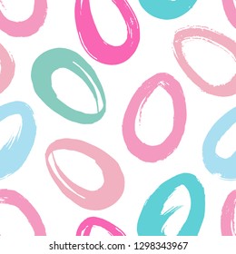 Vector seamless pattern with hand drawn simple silhouettes of easter eggs . Multicolor pink and blue pastel colors. Minimalistic design