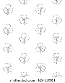 Vector seamless pattern of hand drawn doodle sketch shamrock clover isolated on white background