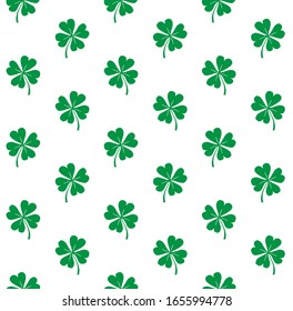 Vector seamless pattern of hand drawn doodle sketch green shamrock clover isolated on white background