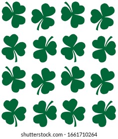 Vector seamless pattern of hand drawn doodle green trefoil clover shamrock silhouette isolated on white background