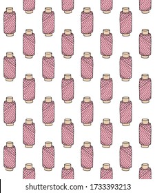 Vector seamless pattern of hand drawn doodle sketch pink threads spool isolated on white background