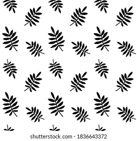 Vector seamless pattern of hand drawn rowan leaf silhouette isolated on white background