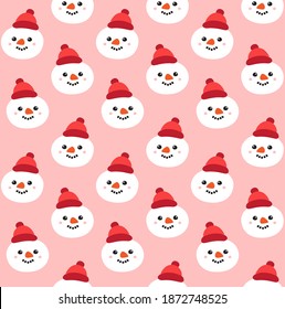 Vector seamless pattern of hand drawn doodle flat snowman face isolated on pink background