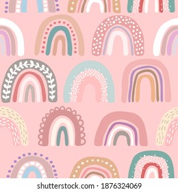 Vector seamless pattern with hand drawn cute rainbows. Simple design for child textile, decoration, wallpaper, stationery.