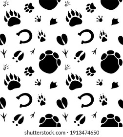 Vector seamless pattern of hand drawn different animals paws footprint isolated on white background