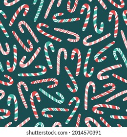 Vector seamless pattern with hand drawn candy canes. Cute design for Christmas wrappings, textile and backgrounds.