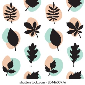 Vector seamless pattern of hand drawn leaves silhouette and abstract dots isolated on white background