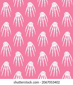 Vector seamless pattern of hand drawn doodle sketch skeleton hand isolated on pink background
