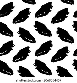 Vector seamless pattern of hand drawn dog wolf skull silhouette isolated on white background