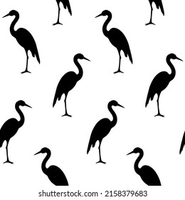 Vector seamless pattern of hand drawn doodle sketch heron silhouette isolated on white background