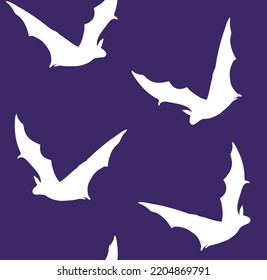 Vector seamless pattern of hand drawn bat silhouette isolated on purple background