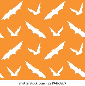 Vector seamless pattern of hand drawn bat silhouette isolated on orange background