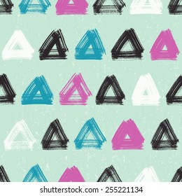 Vector seamless pattern with hand drawn triangles .