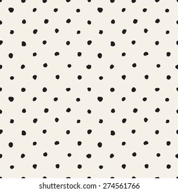 Vector seamless pattern. Hand drawn polka dot texture. Stylish monochrome doodles. Modern graphic design.