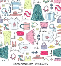 Vector seamless pattern of hand drawn fashion collection with summer women's clothing. Background for use in design, web site, packing, textile, fabric