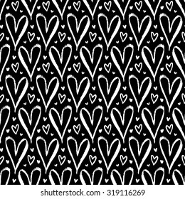 Vector seamless pattern with hand drawn hearts in black and white. Simple elegant, romantic background for Valentine day, Mothers day and other family events. Small ditsy chic print for textile design