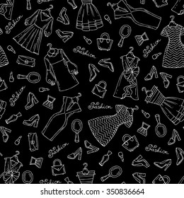 Vector seamless pattern with hand drawn dresses, shoes and accessories for women on black color. Pattern on the theme of fashion. Background for use in design, packing, textile, fabric