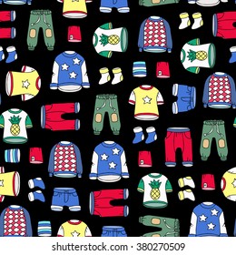 Vector seamless pattern with hand drawn colored clothes for boys and girls on black color. Pattern on the theme of fashion and children's wear. Background for use in design, packing, web site, fabric
