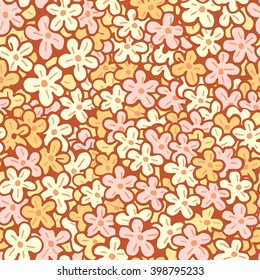 Vector seamless pattern with hand drawn flowers. In yellow and orange colors.
