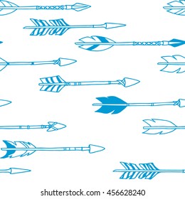 Vector seamless pattern with hand drawn tribal arrows. Beautiful ethnic design elements.